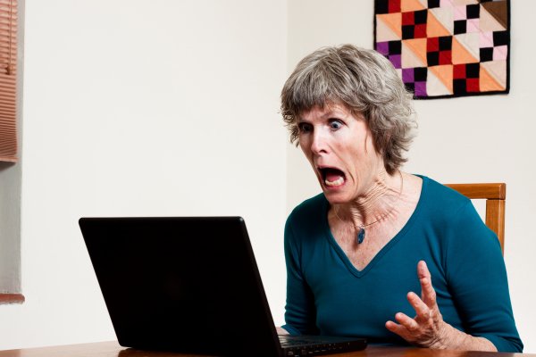 woman angry in front of laptop online backup 